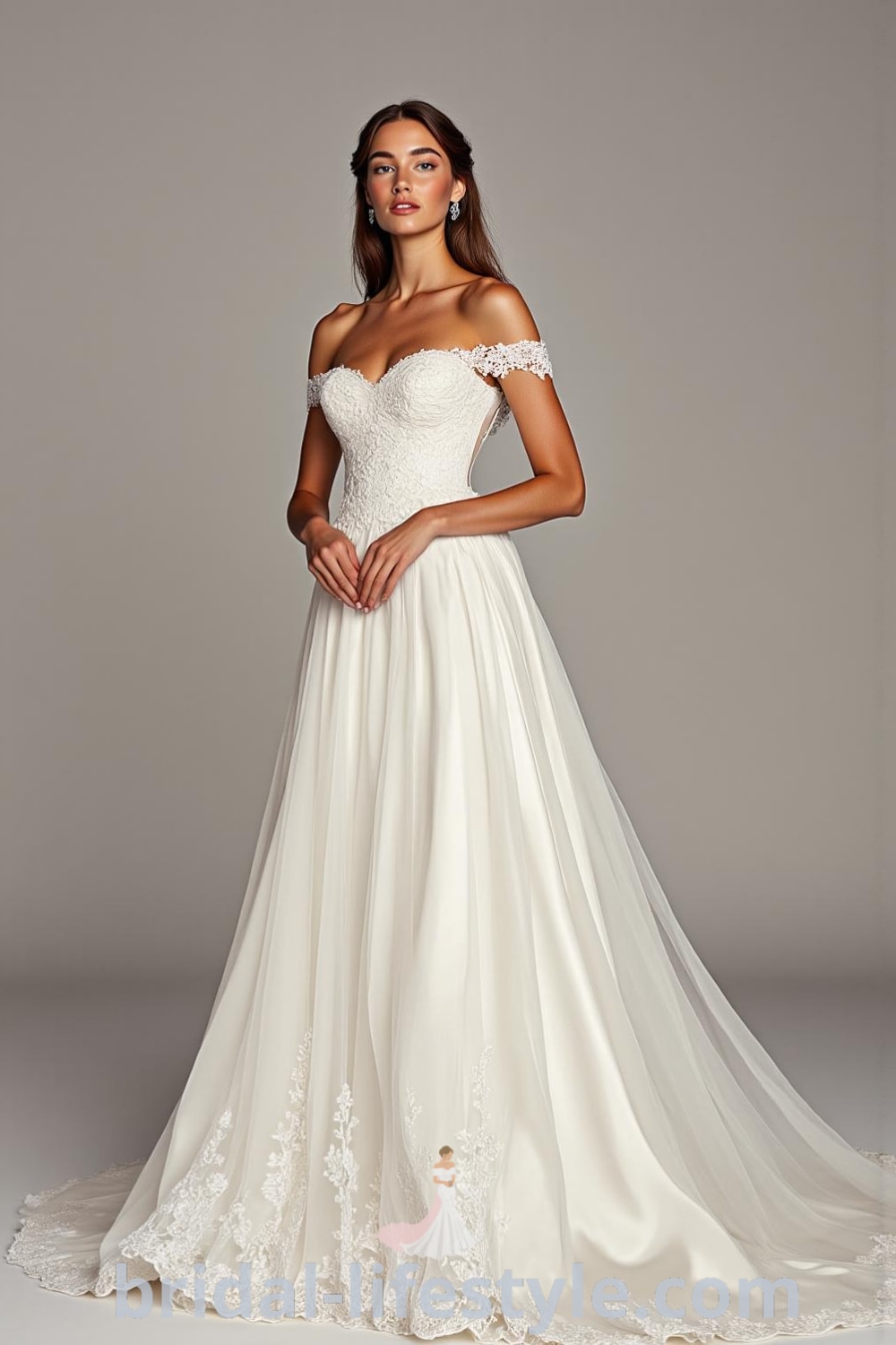 Elegant off-the-shoulder A-line wedding dress made of satin and lace, featuring a flowing skirt and delicate embroidery on bodice and hem. bridal-lifestyle.com