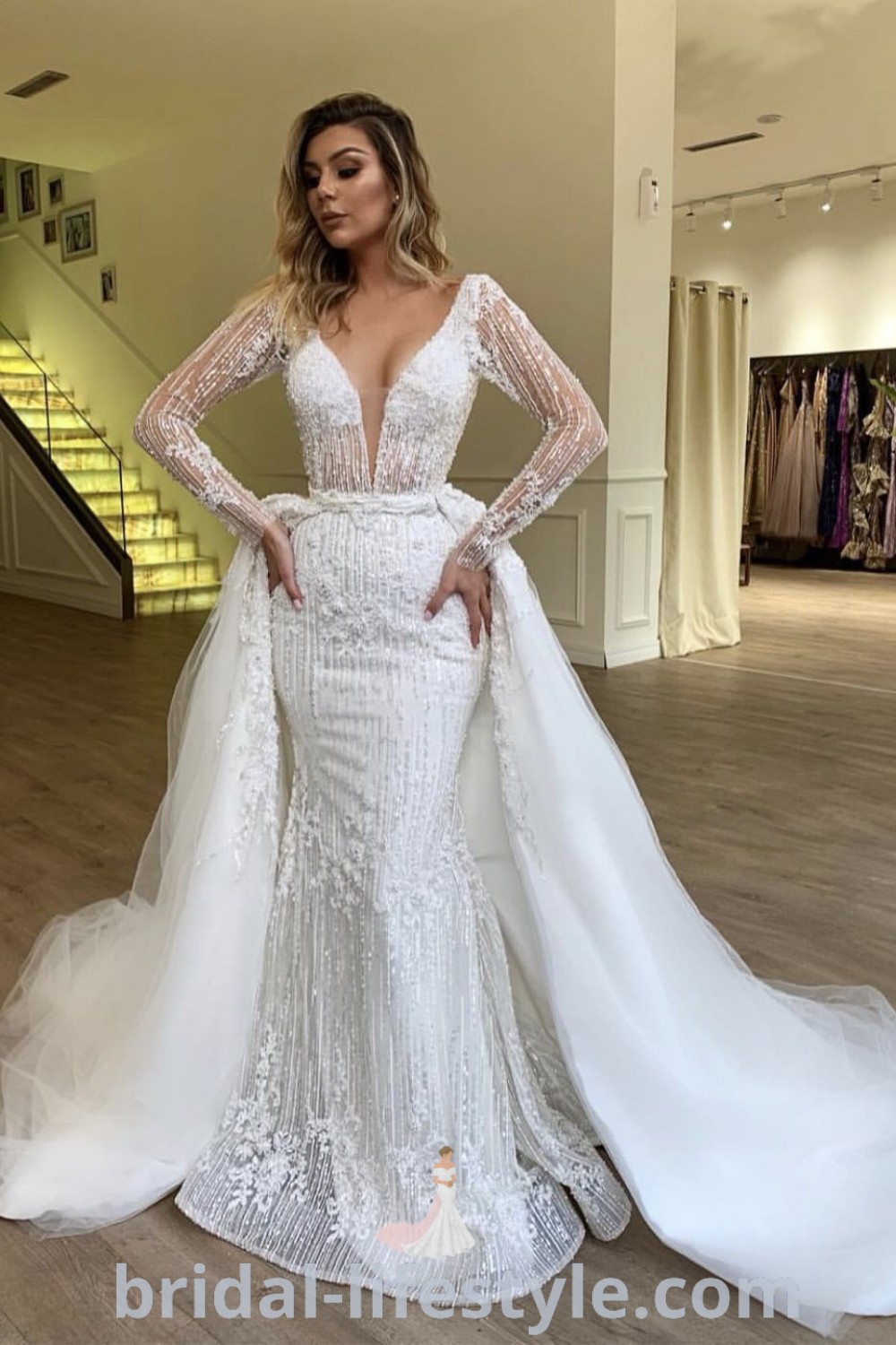 An elegant long sleeve wedding dress with a detachable train, ideal for dreamy brides seeking a unique look. This wedding gown highlights trends like wedding dresses with removable skirts, providing chic options for every bride
