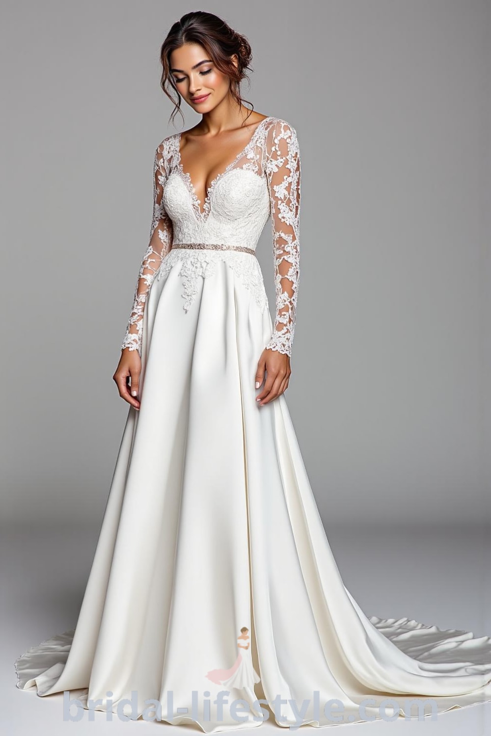 A-line wedding dress with long lace sleeves, soft satin skirt, lace overlay on the bodice, and an illusion neckline. bridal-lifestyle.com