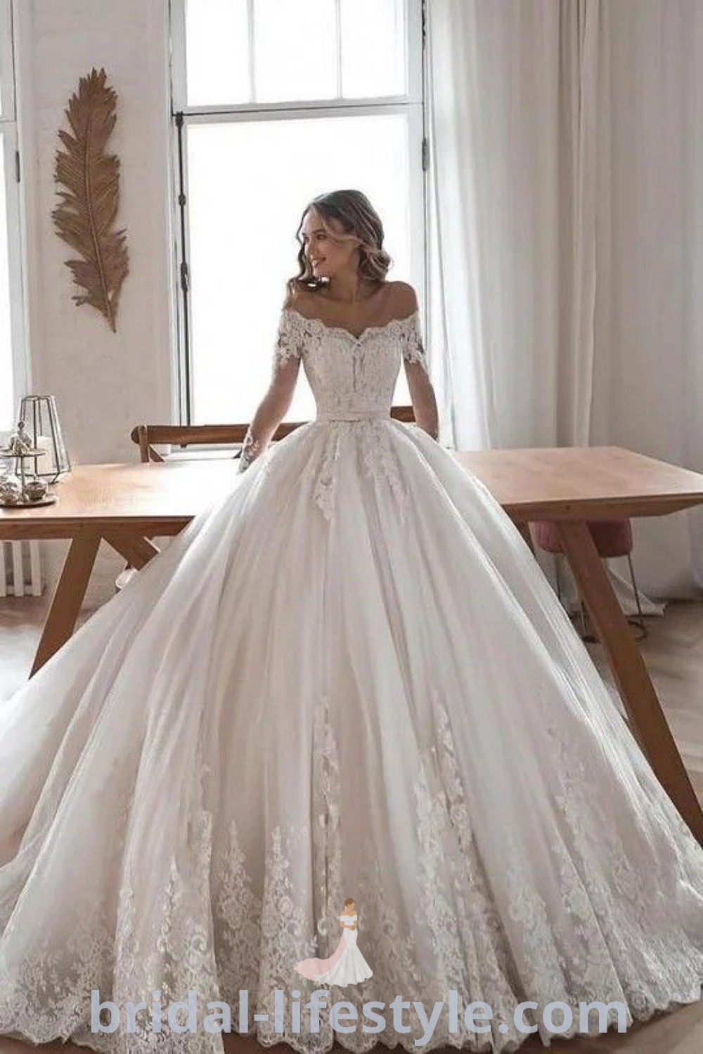 An elegant wedding dress featuring beautiful ball gown sleeves and lace detailing, perfect for the special day. This stunning gown represents the best bridal trends for 2024, appealing to every bride’s unique taste and aesthetic ideas. Find more inspiration at bridal-lifestyle.com.