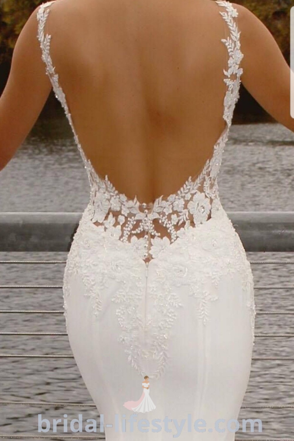 An elegant open back lace wedding dress showcasing bridal trends with a romantic touch, perfect for dreamy brides. This stunning gown incorporates satin and lace details, ideal for those seeking the best aesthetic ideas for their special day. Find more inspiration on bridal-lifestyle.com.