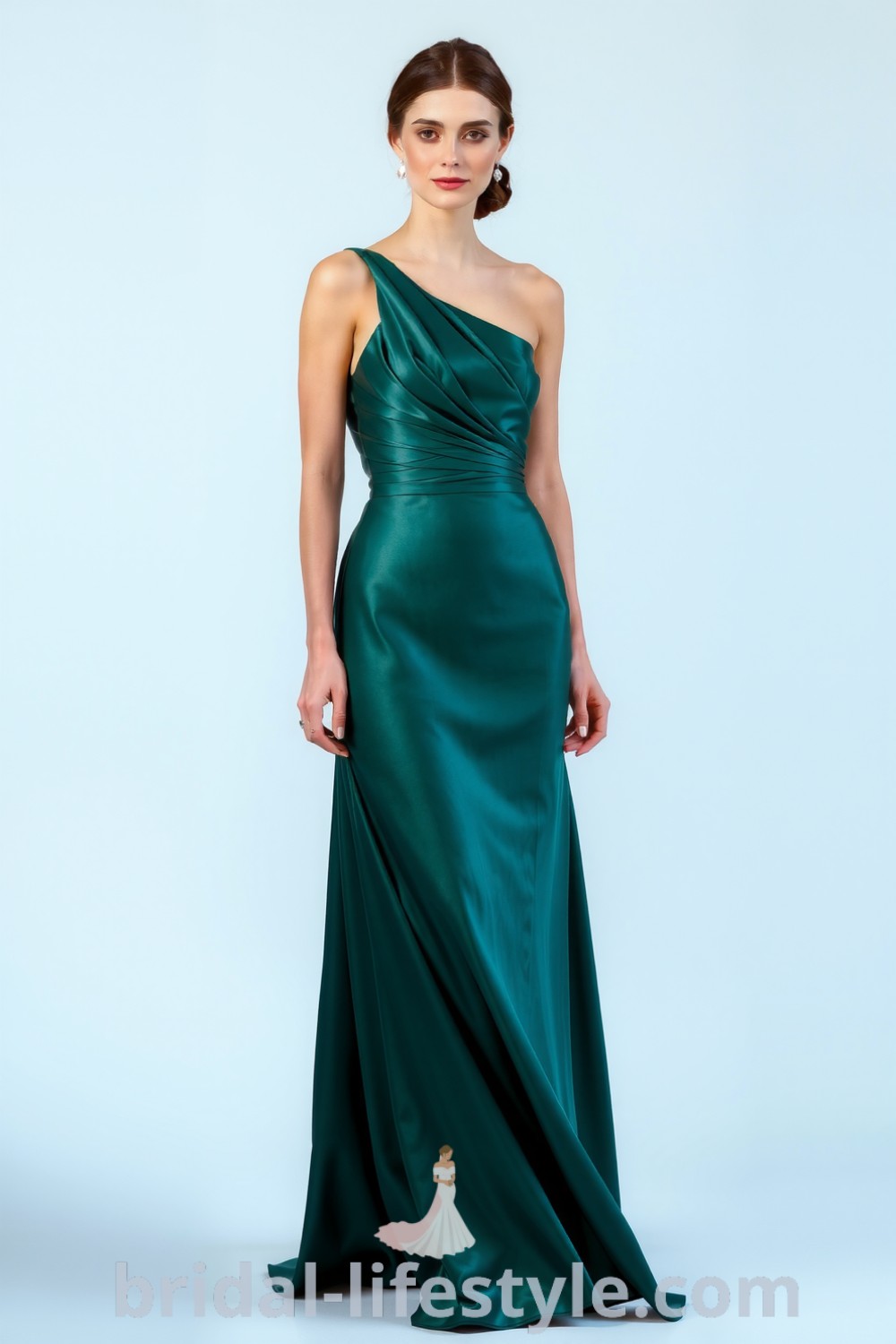 One-shoulder emerald bridesmaid dress in flowing satin with elegant silhouette, subtle ruching at the waist, and cascading layers, perfect for every bride