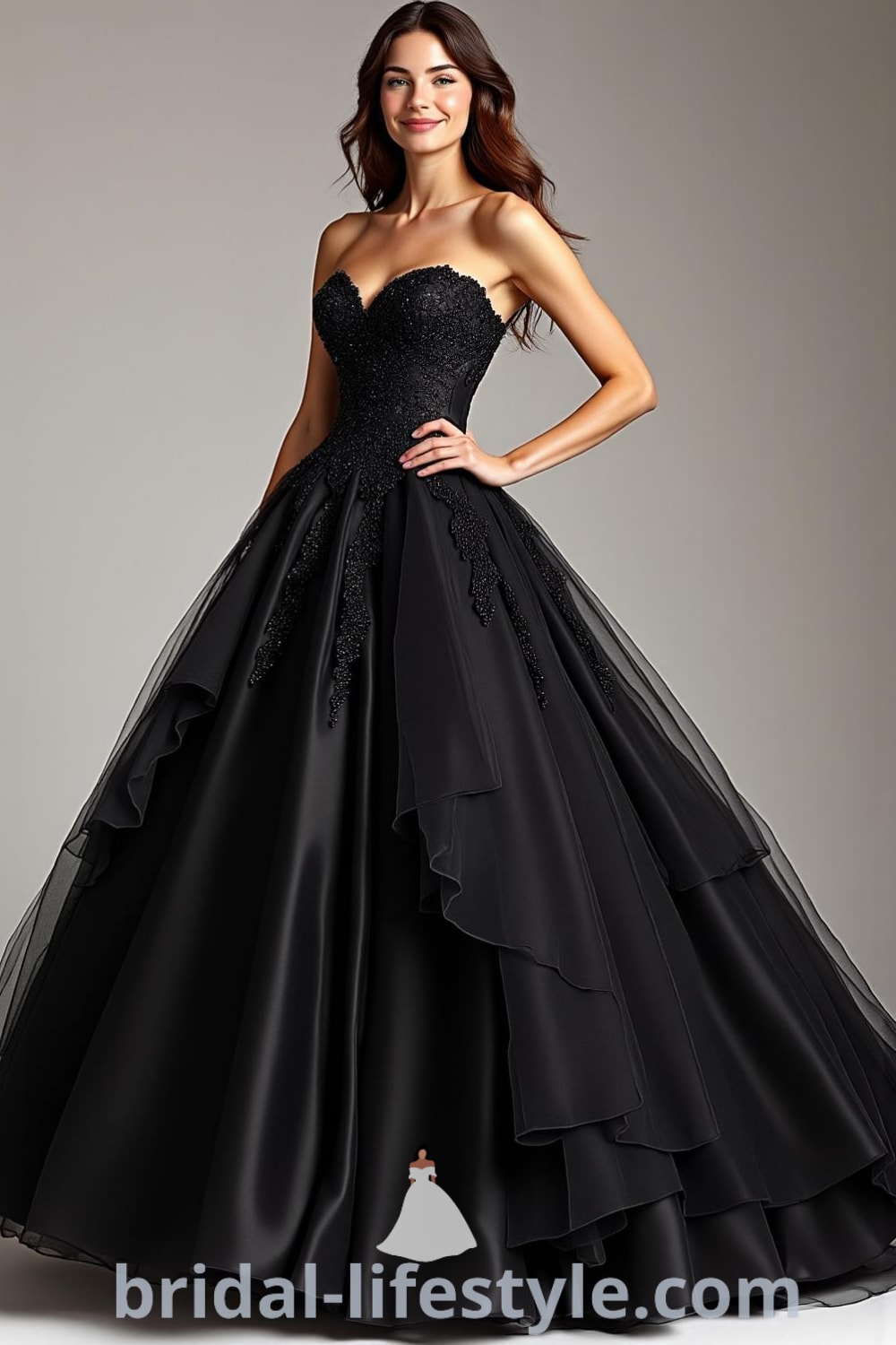 A stunning black wedding dress featuring a fitted lace bodice, voluminous satin skirt, and cascading layers of tulle, designed for a modern bridal look. bridal-lifestyle.com
