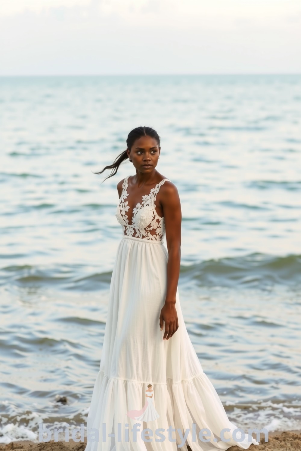 A Black bride wearing a boho beach wedding dress made from soft linen, featuring intricate lace detailing and a flowing A-line silhouette, ideal for a seaside ceremony. bridal-lifestyle.com