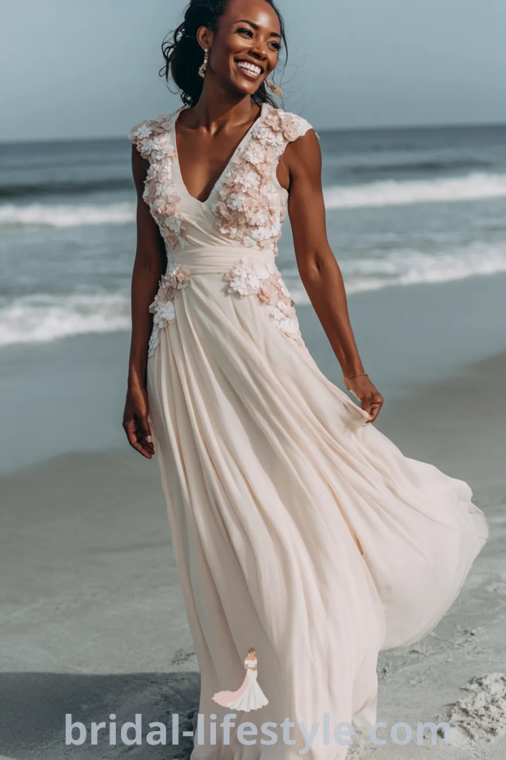 Black bride in a flowy chiffon beach wedding dress, soft blush accents, lightweight lace details, relaxed beach bridal style.