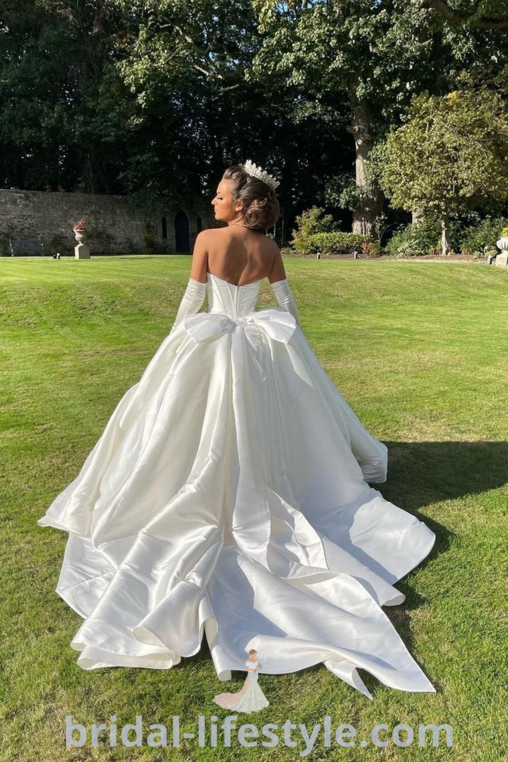 An elegant satin Cinderella wedding dress in a ball gown style, featuring gloves for a romantic and dreamy bridal look. This dress is perfect for brides seeking timeless inspiration for their special day. Explore more at bridal-lifestyle.com.
