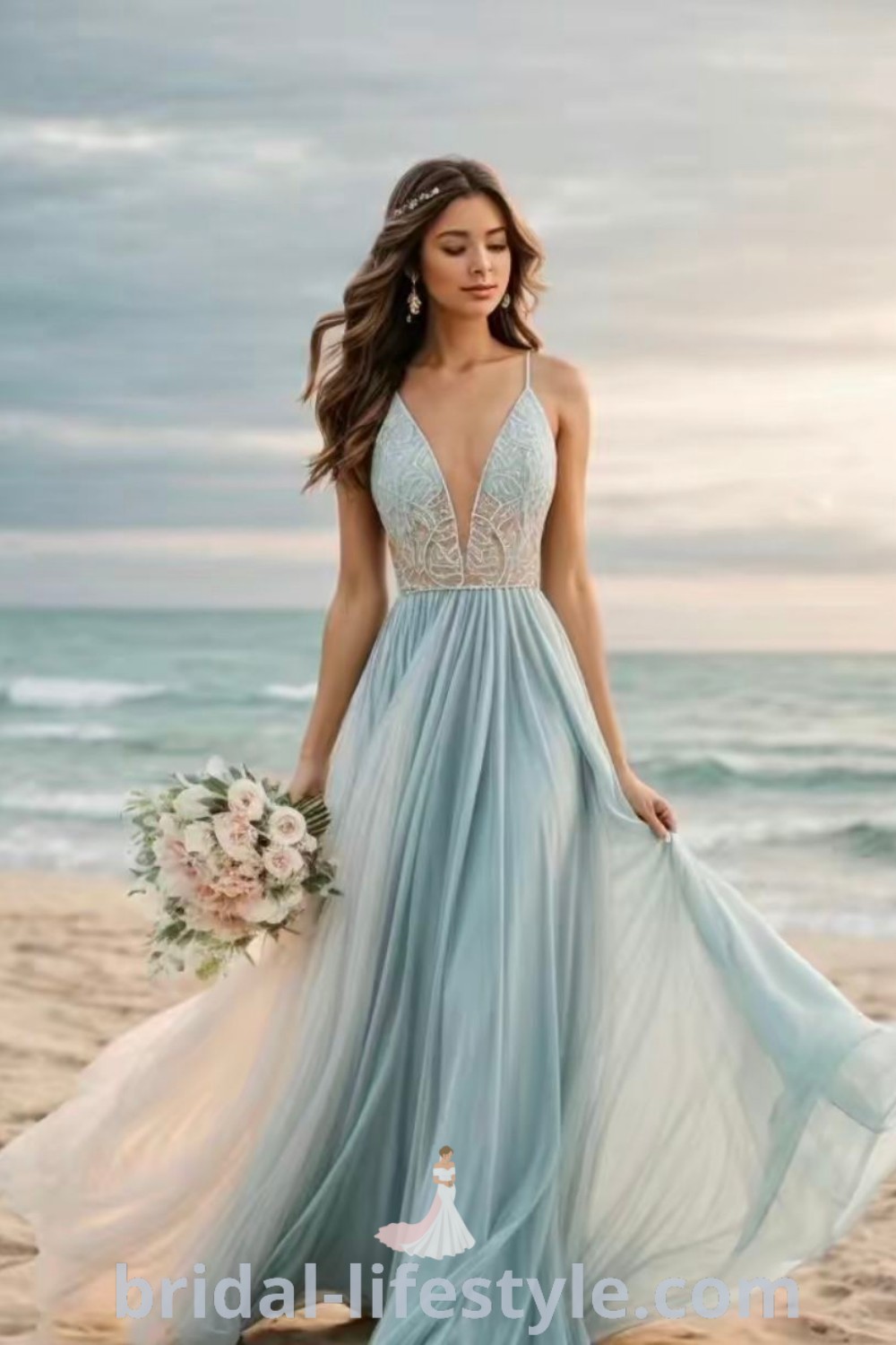 A woman in a blue beach wedding dress stands on a sandy beach, holding a bouquet, showcasing the perfect attire for a casual beach wedding. This elegant dress embodies dreamy aesthetics and is ideal for every bride’s unique taste. Discover more inspirations at bridal-lifestyle.com.