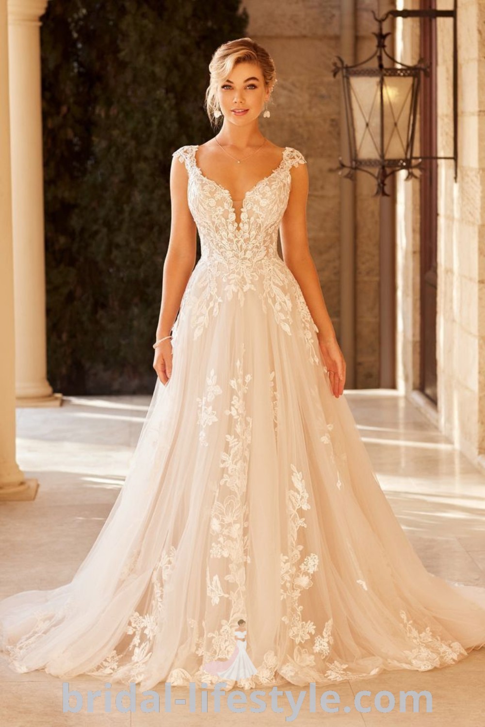 A woman in a wedding dress posing elegantly in a natural setting, showcasing various types of wedding gowns like the Long Sleeve Floral Wedding Dress and Tuscan Wedding Dress. This scene captures the romantic and dreamy essence of bridal style for every bride
