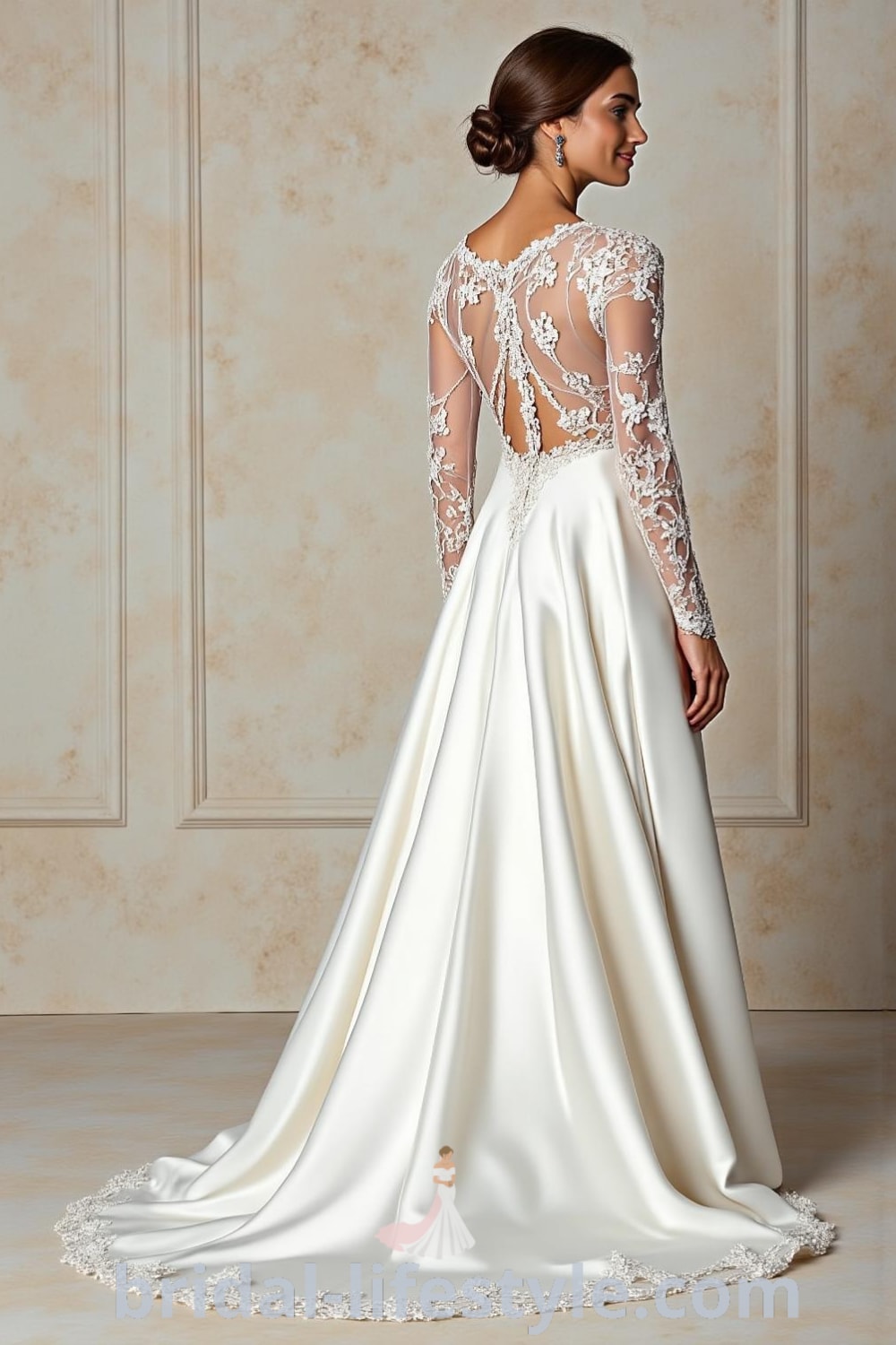 A-line wedding dress with long sheer lace sleeves, a satin skirt, scoop neckline, and an illusion back with button embellishments. bridal-lifestyle.com