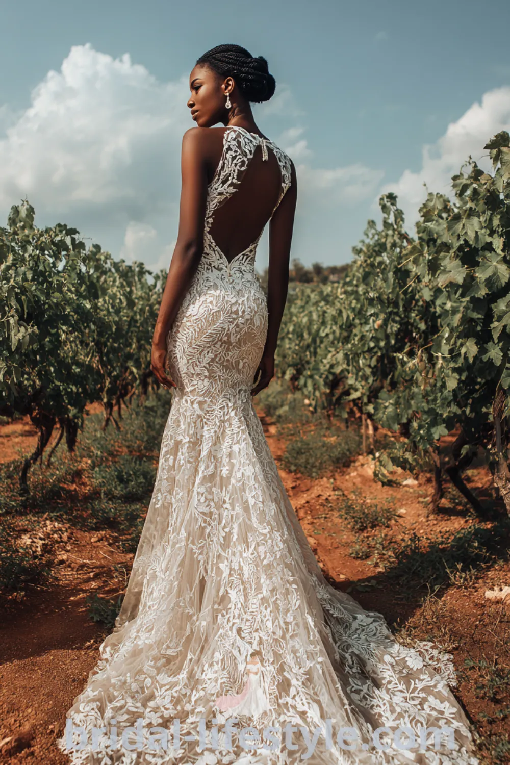 Stunning mermaid lace wedding dress with floral patterns, fitted lace bridal gown, vineyard wedding inspiration, elegant lace details.