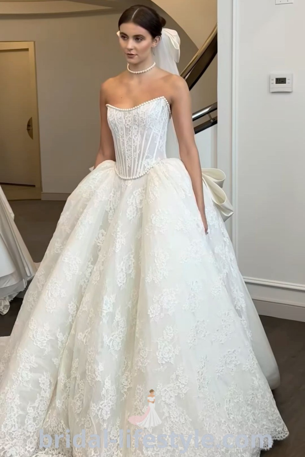 An elegant Pnina Tornai wedding dress with pearl beading and long sleeves, ideal for brides looking for sophisticated layered wedding outfits. This stunning gown reflects the best trends and aesthetics, making it perfect for the special day. Explore more at bridal-lifestyle.com.