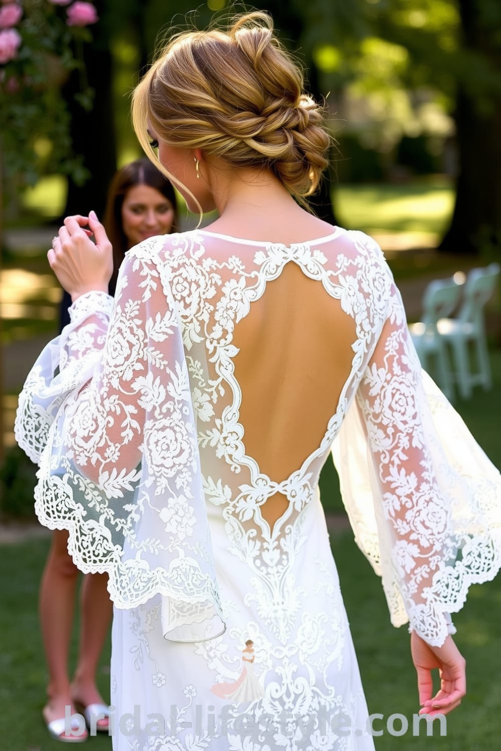 Bridal gown featuring a boho style with long sleeves, intricate floral lace, an open back, and scalloped edges, perfect for an outdoor wedding. bridal-lifestyle.com