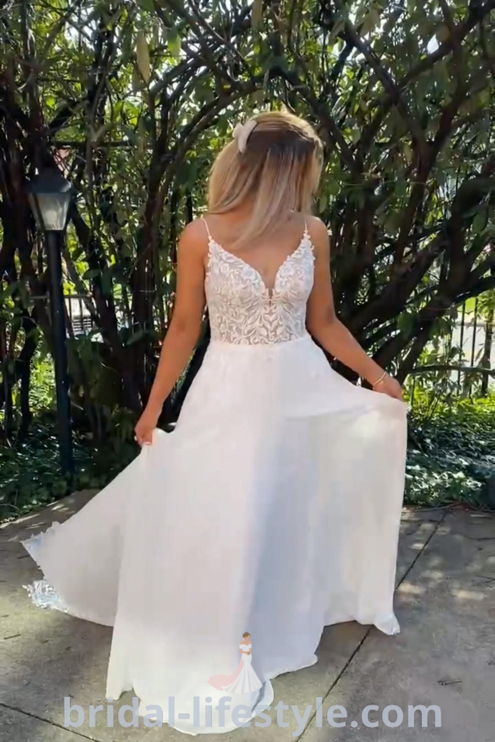 A stunning lace top wedding dress featuring a chiffon bottom, embodying romantic elegance and stylish trends for brides. Perfect for the special day, this gown combines timeless design with practical features like pockets. Explore more wedding dress inspirations at bridal-lifestyle.com.