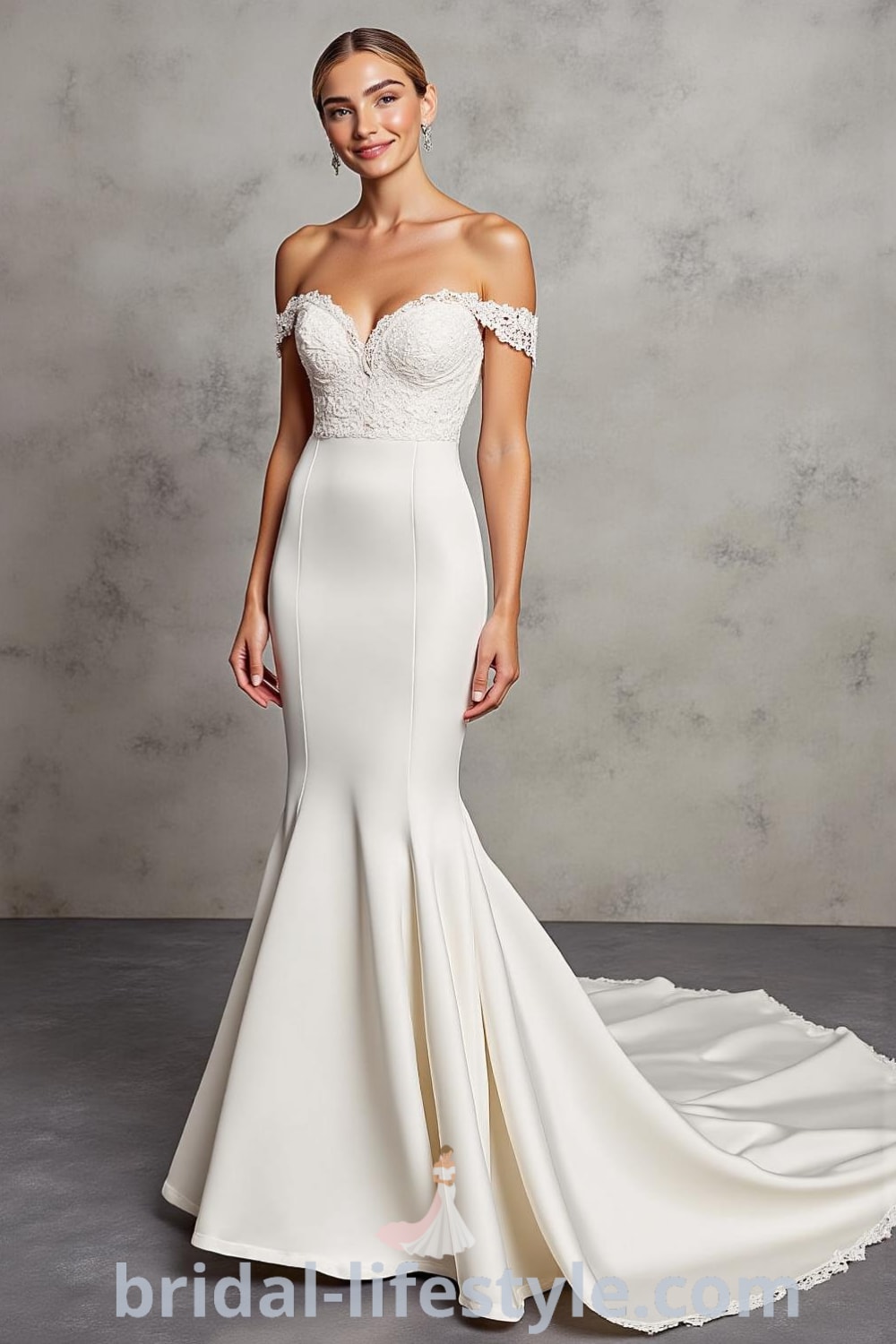 Mermaid wedding dress in luxurious satin with off-the-shoulder lace appliqué neckline and detachable tulle overskirt, perfect for a stylish bride. bridal-lifestyle.com