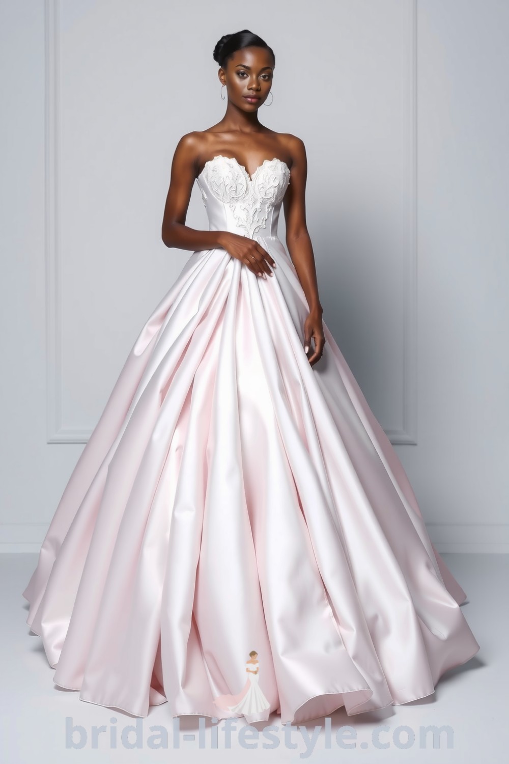 Stunning princess ballgown with luxurious satin layers, strapless lace bodice, and voluminous tulle skirt, perfect for dreamy brides. bridal-lifestyle.com