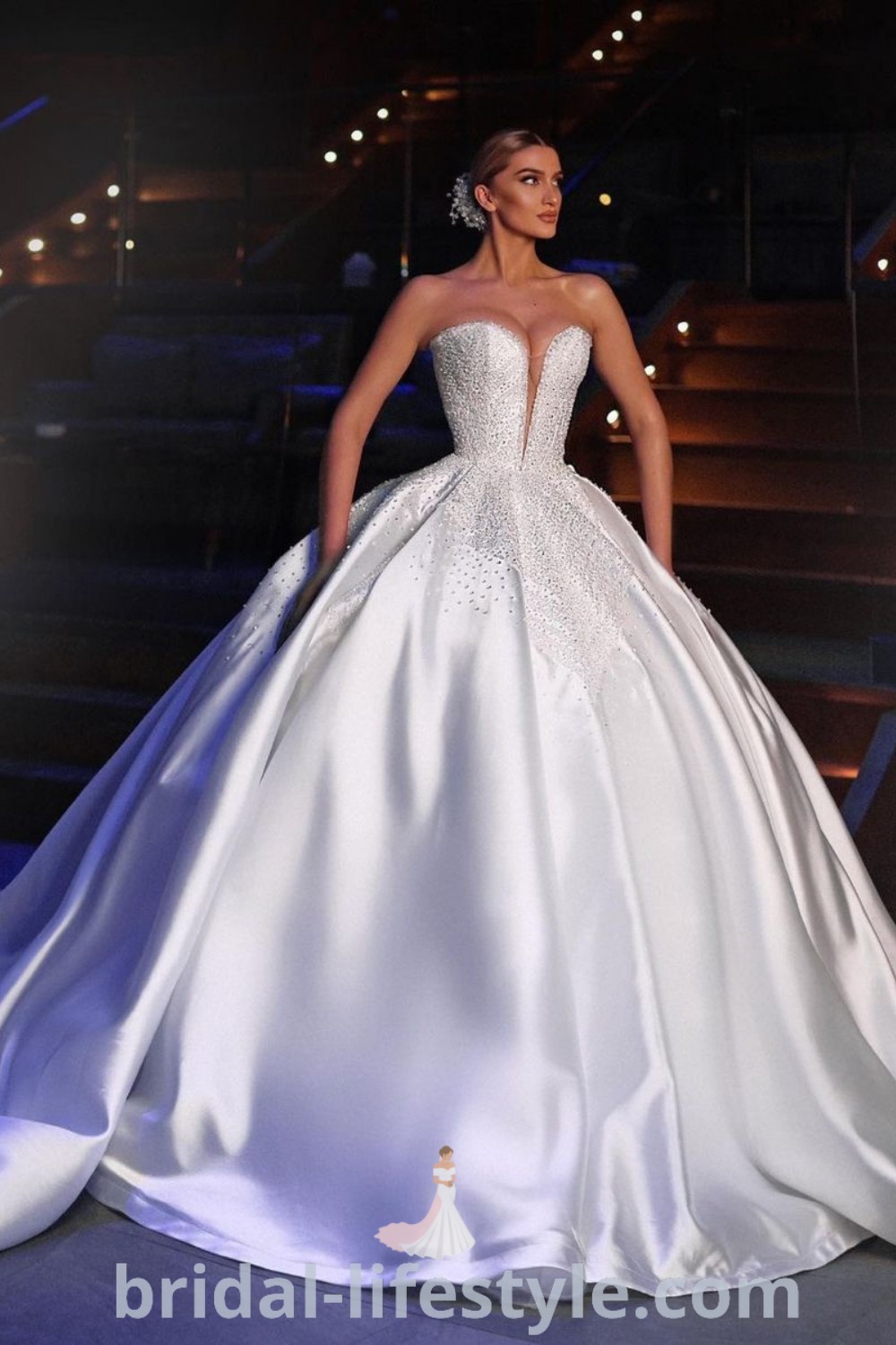 An elegant wedding dress with luxurious lace fabrics, showcasing a stunning ballgown silhouette inspired by Cinderella. Ideal for brides seeking romantic and unique gown options, this dress embodies the best wedding inspiration. Discover more at bridal-lifestyle.com.