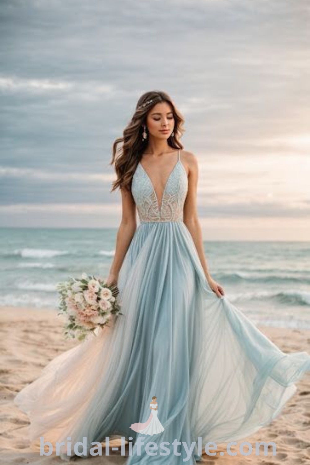 A woman in a blue dress stands on a sandy beach next to the ocean, embodying the essence of a dreamy beach wedding. This scene represents boho beach wedding ideas, featuring elegant dresses for dreamy brides and inspiration for a romantic special day at bridal-lifestyle.com.