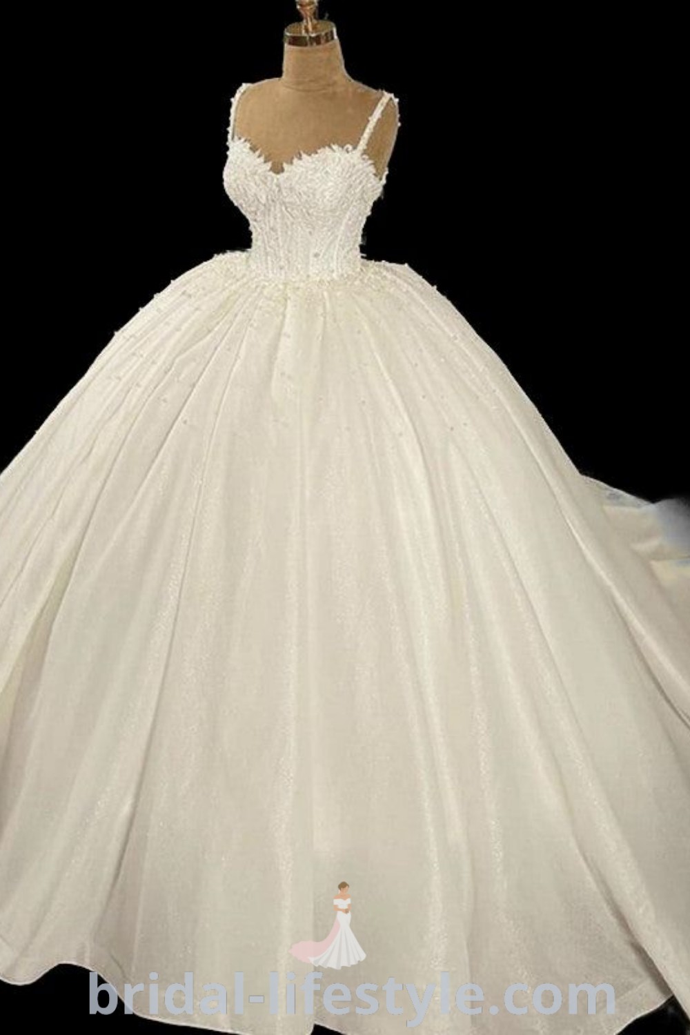 An elegant white ball gown showcased in front of a mannequin