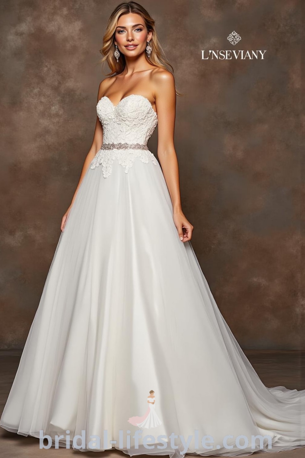 A-line strapless wedding dress with a luxurious satin bodice, soft tulle skirt, sweetheart neckline, and lace appliqués, featuring a hidden pocket for practicality. bridal-lifestyle.com