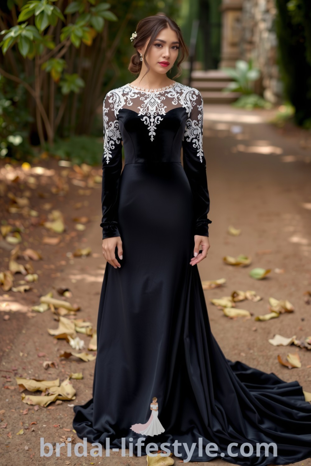 Boho black wedding dress made of luxurious velvet, featuring intricate lace overlay on sleeves and neckline, and a flowing silhouette with a subtle train. bridal-lifestyle.com