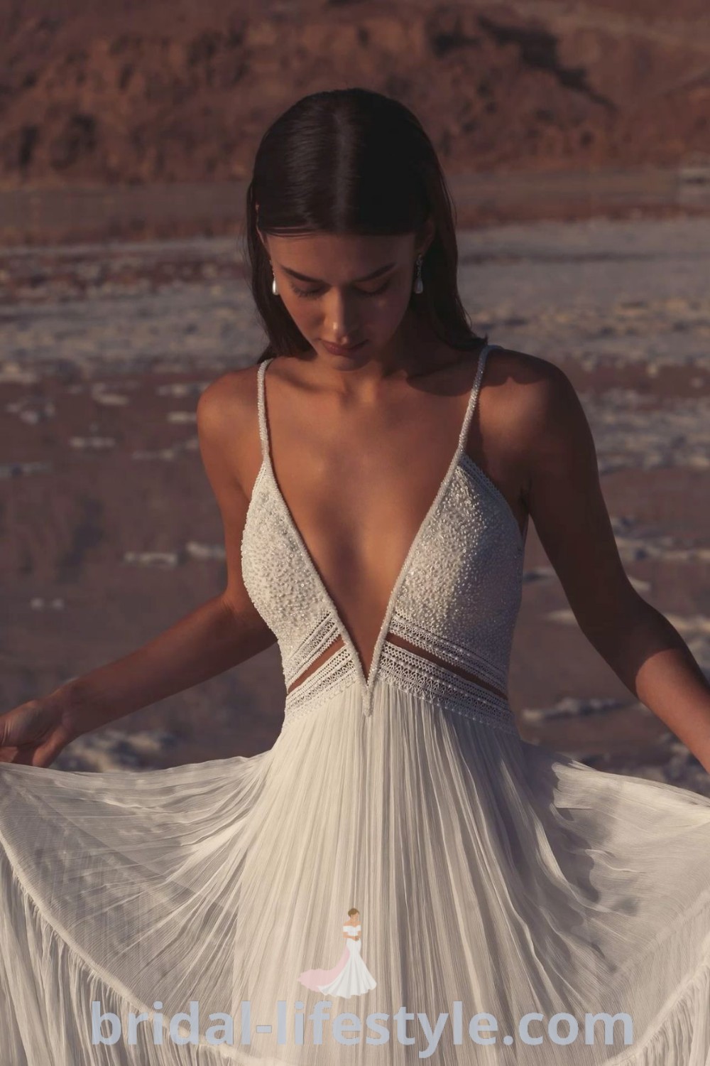 A beautiful boho beach wedding dress designed for dreamy brides, showcasing the best wedding ideas and dresses. Perfect for seaside celebrations, this gown captures elegance and romance. Explore ultimate wedding inspiration at bridal-lifestyle.com.