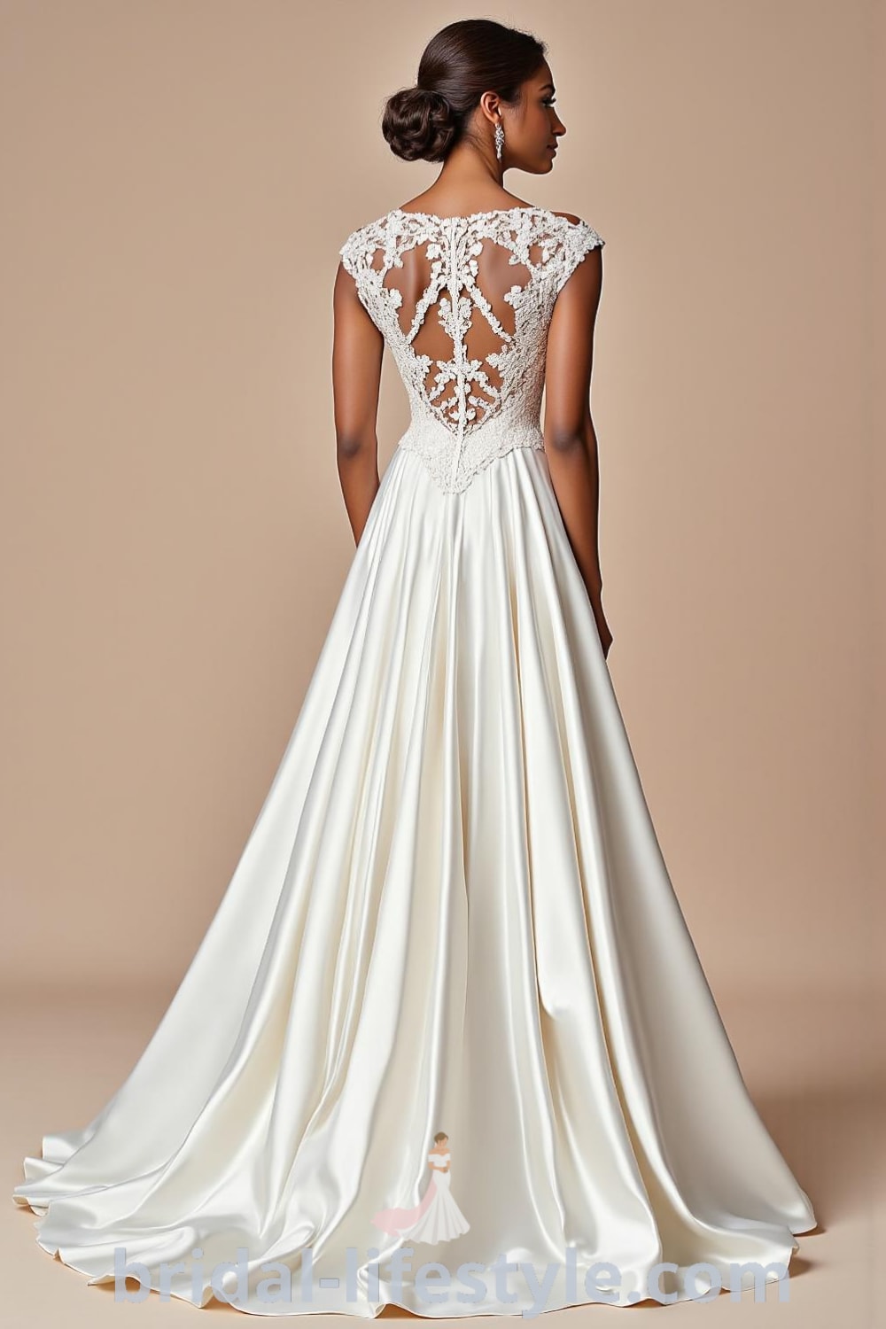 A-line wedding dress featuring an intricate lace bodice, flowing satin skirt, delicate cap sleeves, modest scoop neckline, and illusion lace panel with satin-covered buttons. bridal-lifestyle.com
