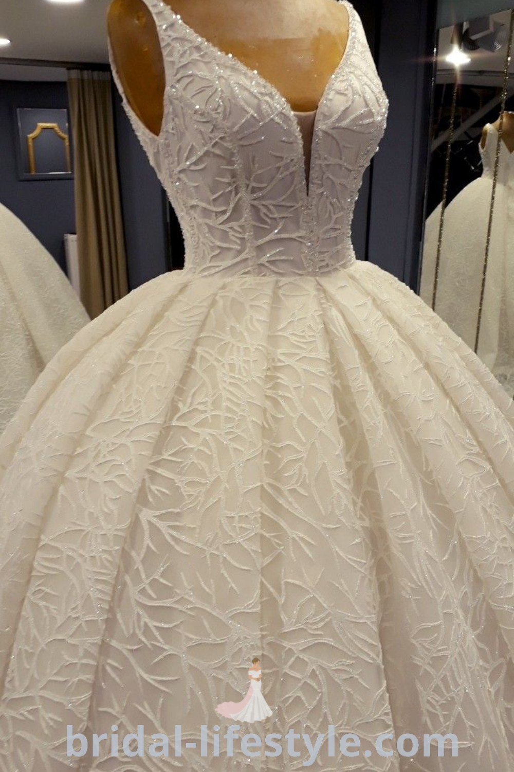 An elegant white dress on display in a store, showcasing beautiful bridal dresses including ballgown wedding dresses and beaded wedding dresses, perfect for dreamy brides. Explore the best wedding dress inspiration at bridal-lifestyle.com.