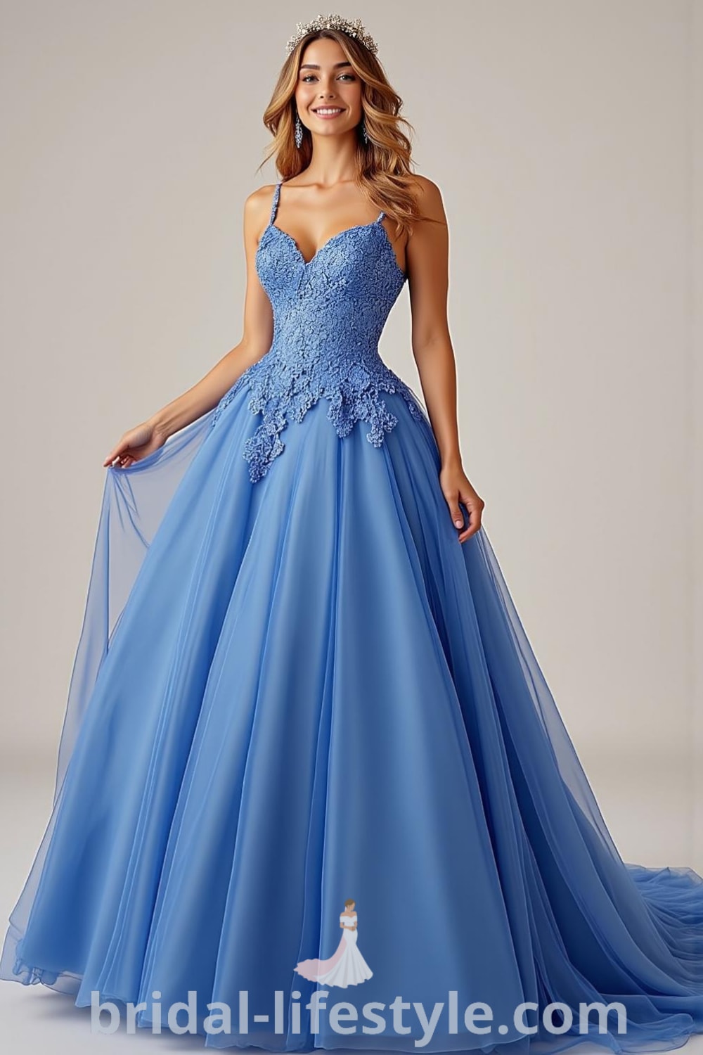 Princess-style wedding dress in blue with fitted bodice, intricate lace appliqués, and voluminous tulle skirt, featuring delicate satin straps for a timeless look. bridal-lifestyle.com