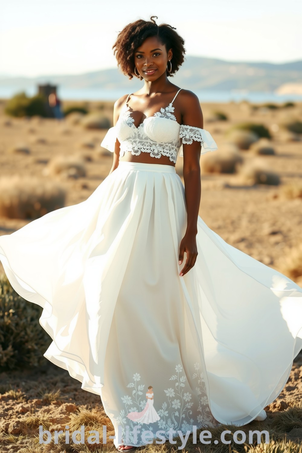 Stunning Black bride wearing an elegant two-piece boho wedding dress with a lace crop top and flowing chiffon skirt, featuring floral embroidery, perfect for dreamy brides. bridal-lifestyle.com