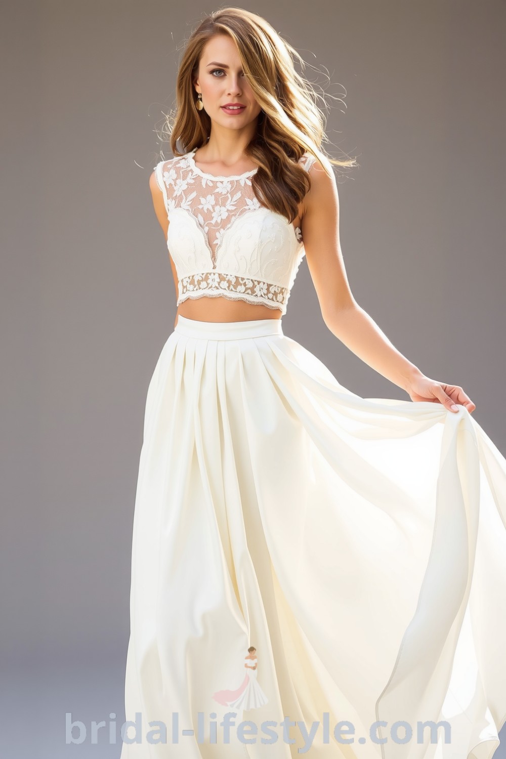 Two-piece boho wedding dress featuring a lace bodice with floral patterns and a flowing satin skirt, perfect for dreamy brides. bridal-lifestyle.com