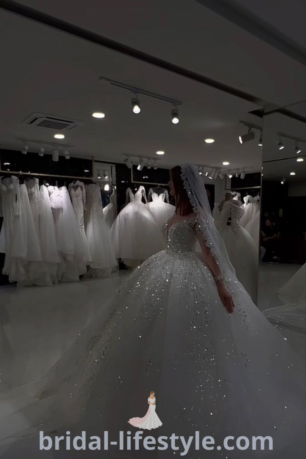 A woman in a wedding dress is admiring puffy and extravagant wedding dresses on display, showcasing big and glittering options ideal for every bride
