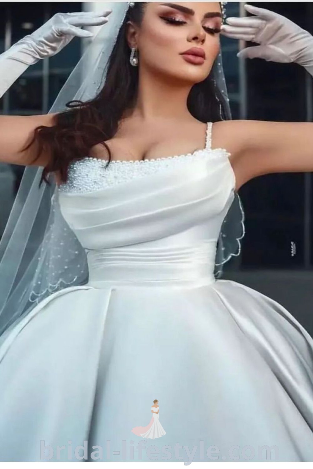 An elegant woman in a white strapless ball gown wedding dress with gloves, exuding romance and sophistication. This stunning aesthetic, perfect for dreamy brides and deb balls, showcases crystal details and beaded accents, making it an ideal choice for every bride
