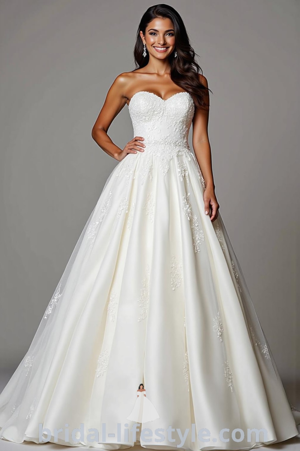Princess Classy wedding dress featuring a structured satin bodice, voluminous tulle skirt, soft sweetheart neckline with lace appliqués, cinched waistline, and a flowing train. bridal-lifestyle.com