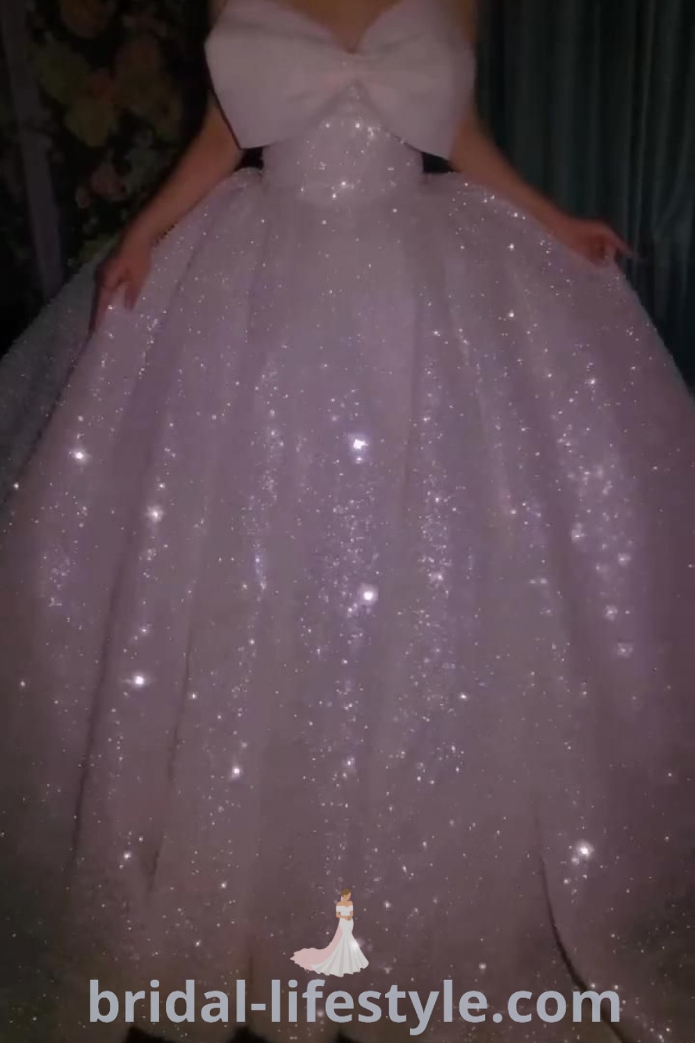 A stunning sparkly white ball gown designed for homecoming and weddings, featuring glittery details that offer elegance and charm for the special day. Discover the best styles and trends at bridal-lifestyle.com.