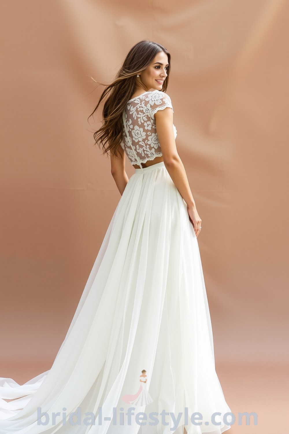 Boho two-piece wedding dress with a lace crop top and flowing chiffon skirt, featuring floral lace details for a romantic silhouette, perfect for outdoor celebrations. bridal-lifestyle.com