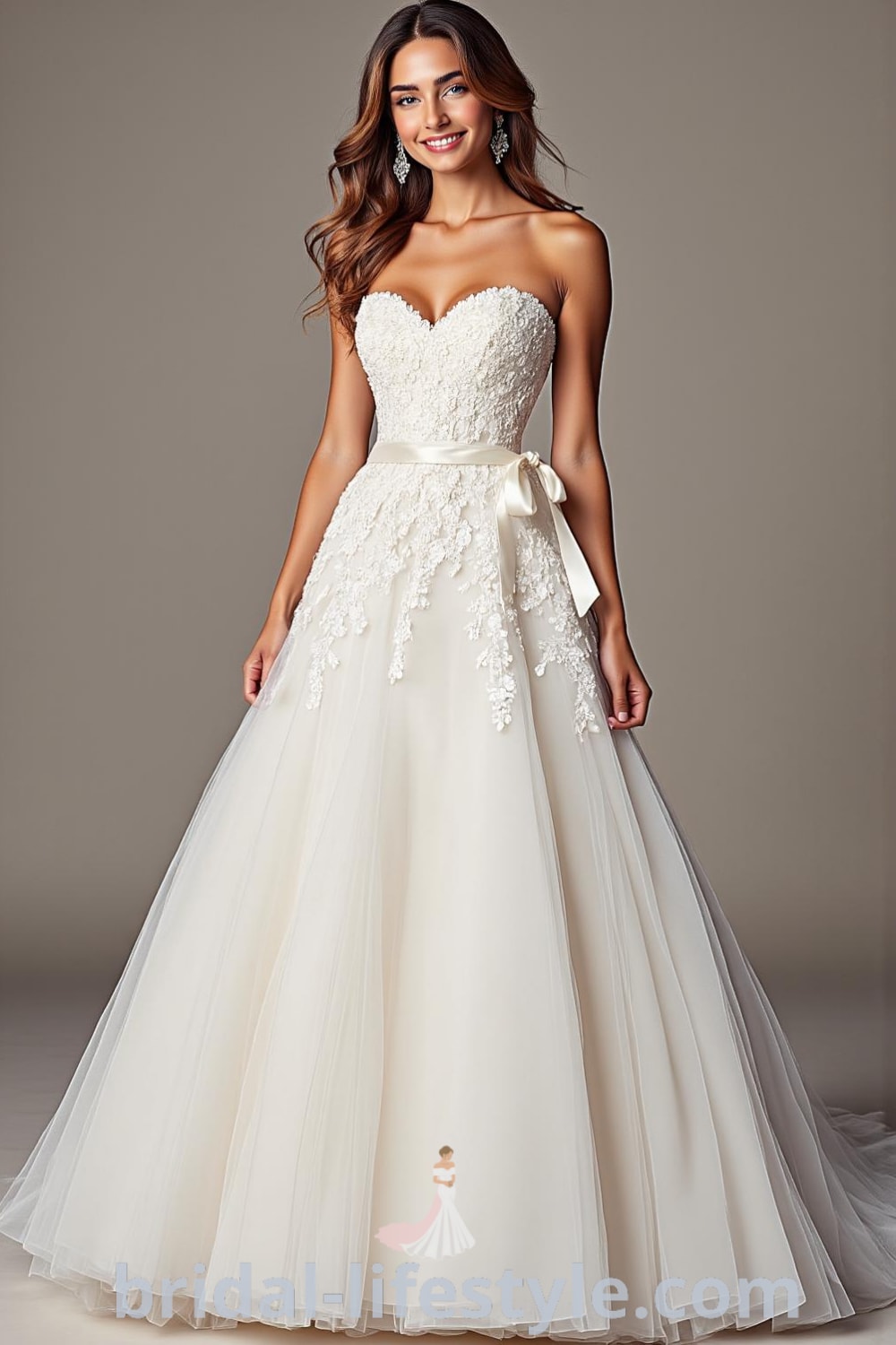 An elegant Princess Tail wedding dress crafted from layers of airy tulle, featuring a fitted bodice with floral lace appliqués, a sweetheart neckline, and delicate satin ribbons at the waist. bridal-lifestyle.com
