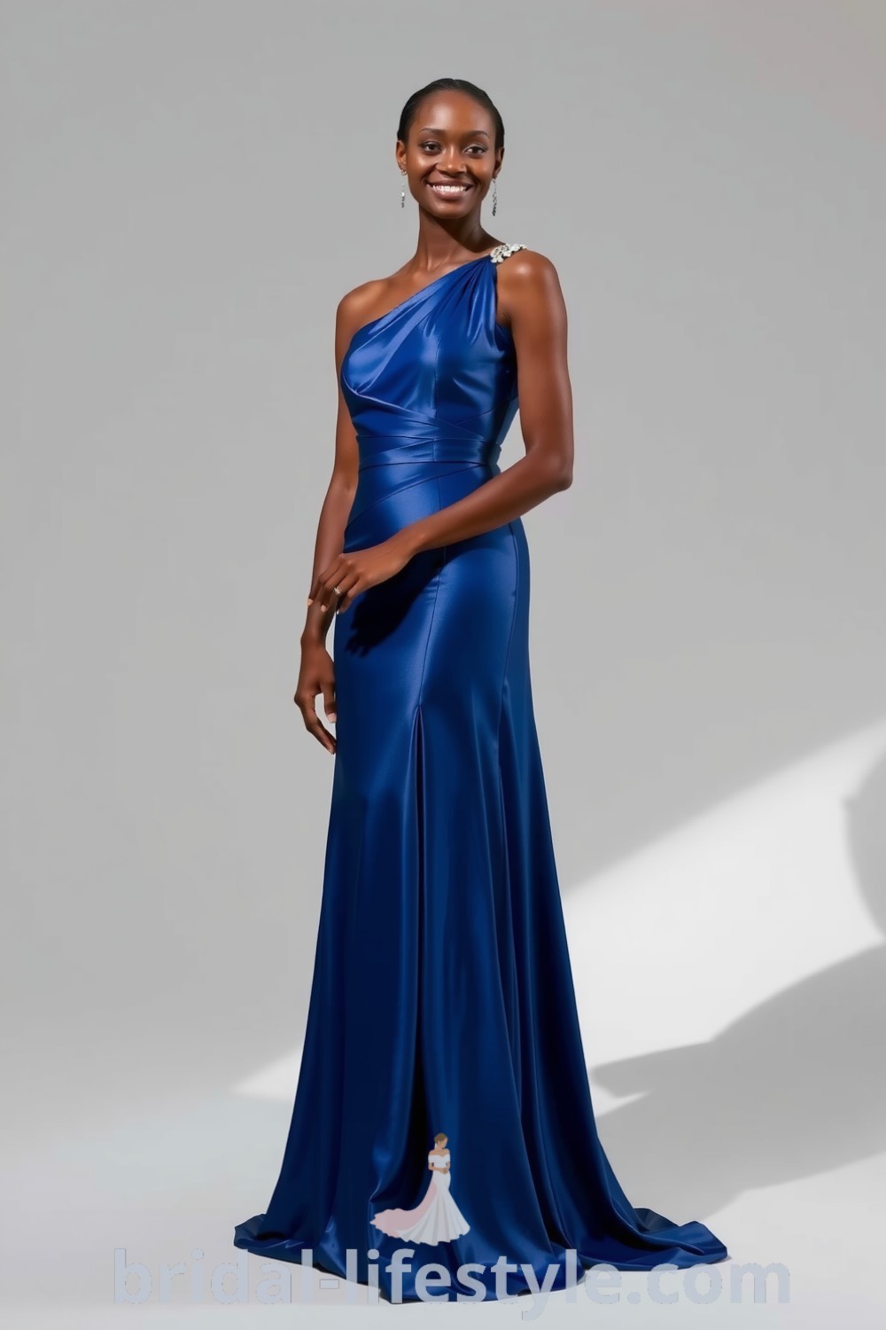 Elegant one-shoulder blue bridesmaid dress in soft satin with a flowing skirt and intricate beadwork, perfect for dreamy brides and special occasions. bridal-lifestyle.com