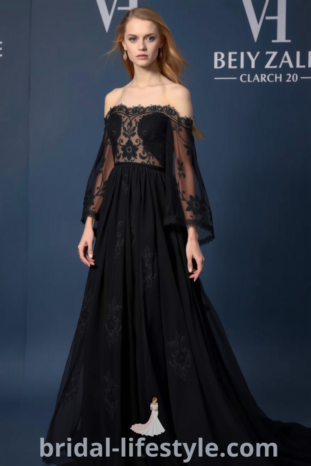A stunning boho black wedding dress with lace overlay, flowing skirt, off-the-shoulder neckline, and cascading sleeves, enhanced by intricate floral patterns. bridal-lifestyle.com