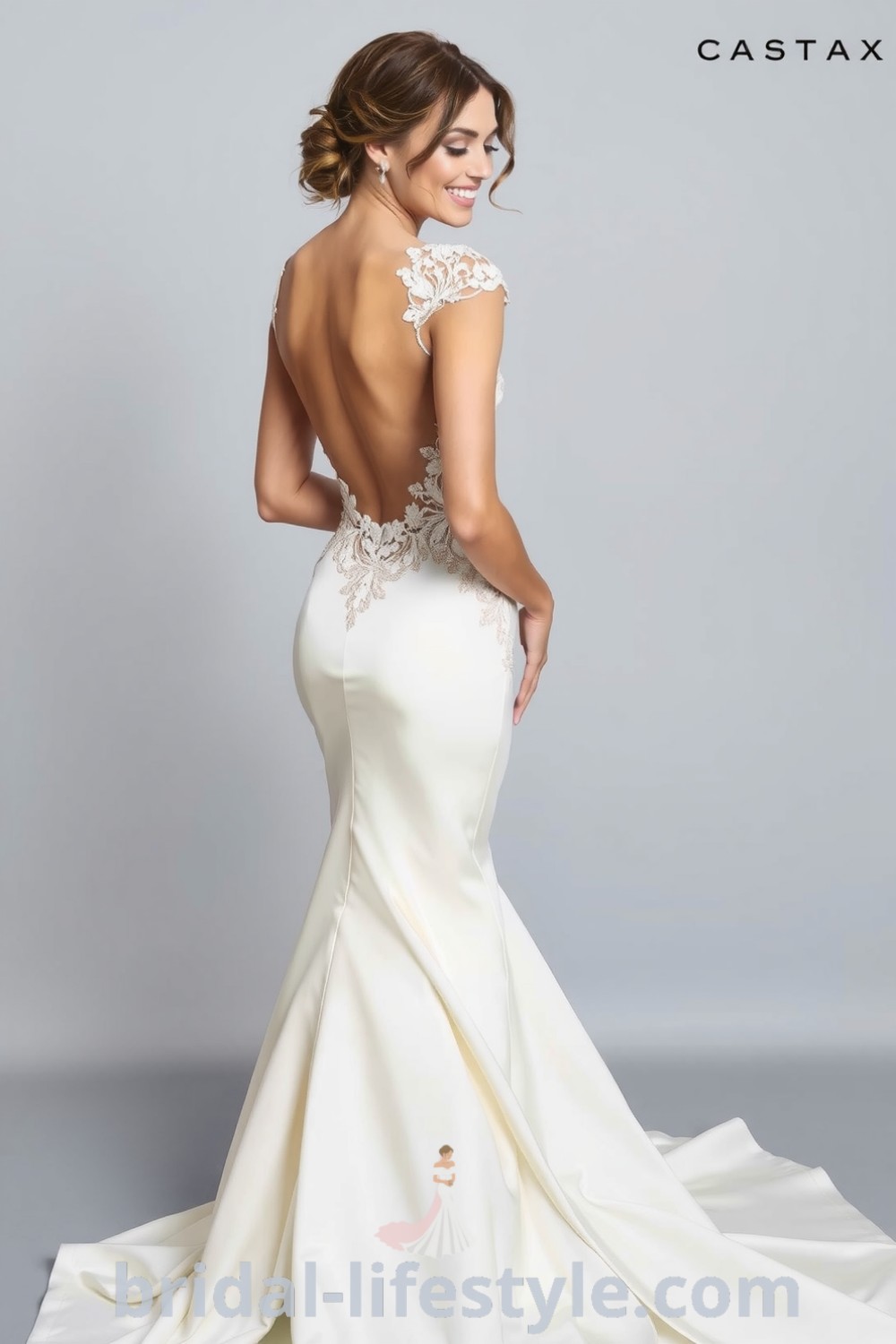 Elegant fit and flare wedding dress with open back, soft satin fabric, and lace appliqués, beautifully highlighting the bride