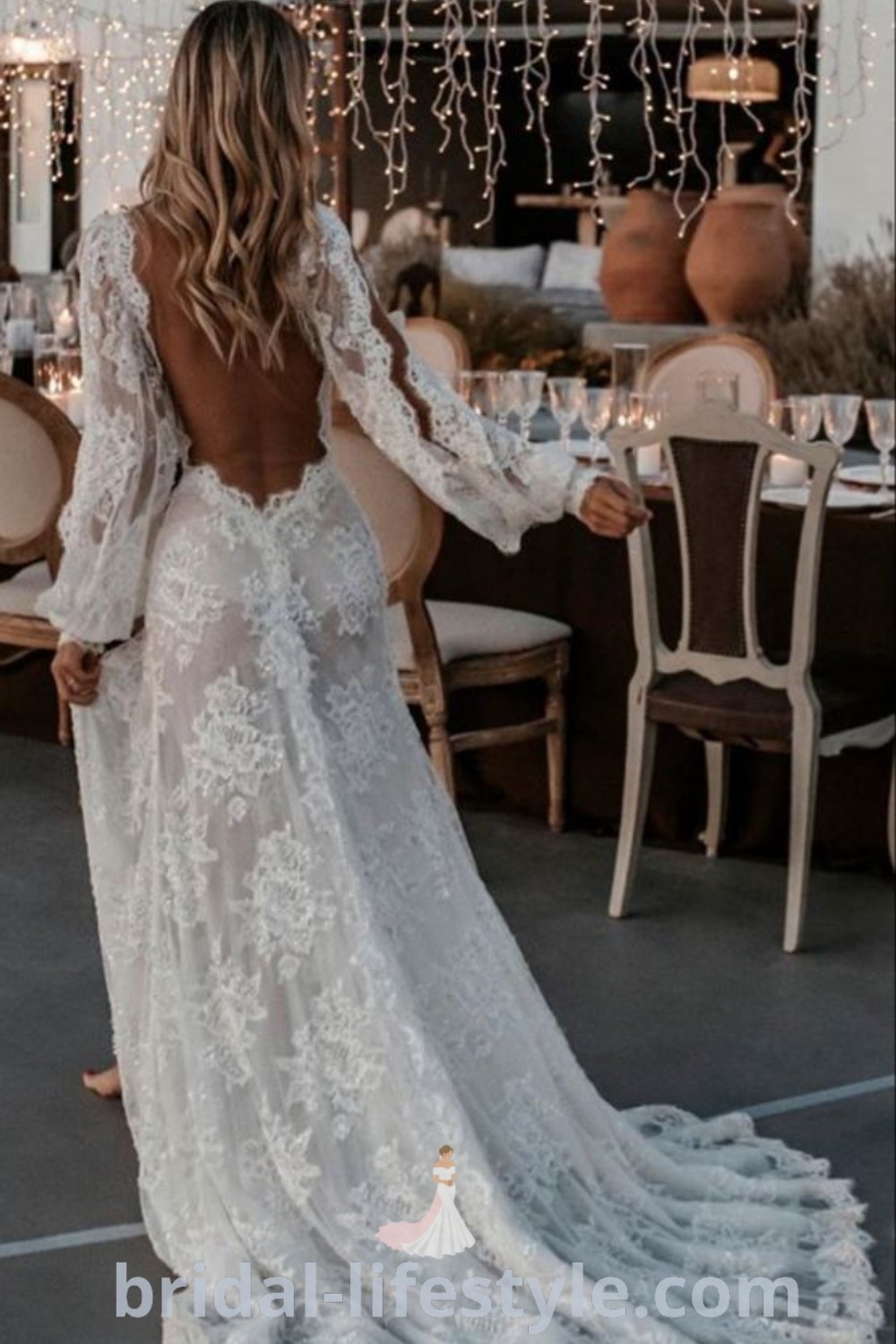 An elegant open-shoulder wedding dress with long sleeves, showcasing the latest wedding dress trends. Ideal for dreamy brides, this dress embodies the best aesthetic ideas for future wedding plans. Explore romantic inspiration looks at bridal-lifestyle.com.