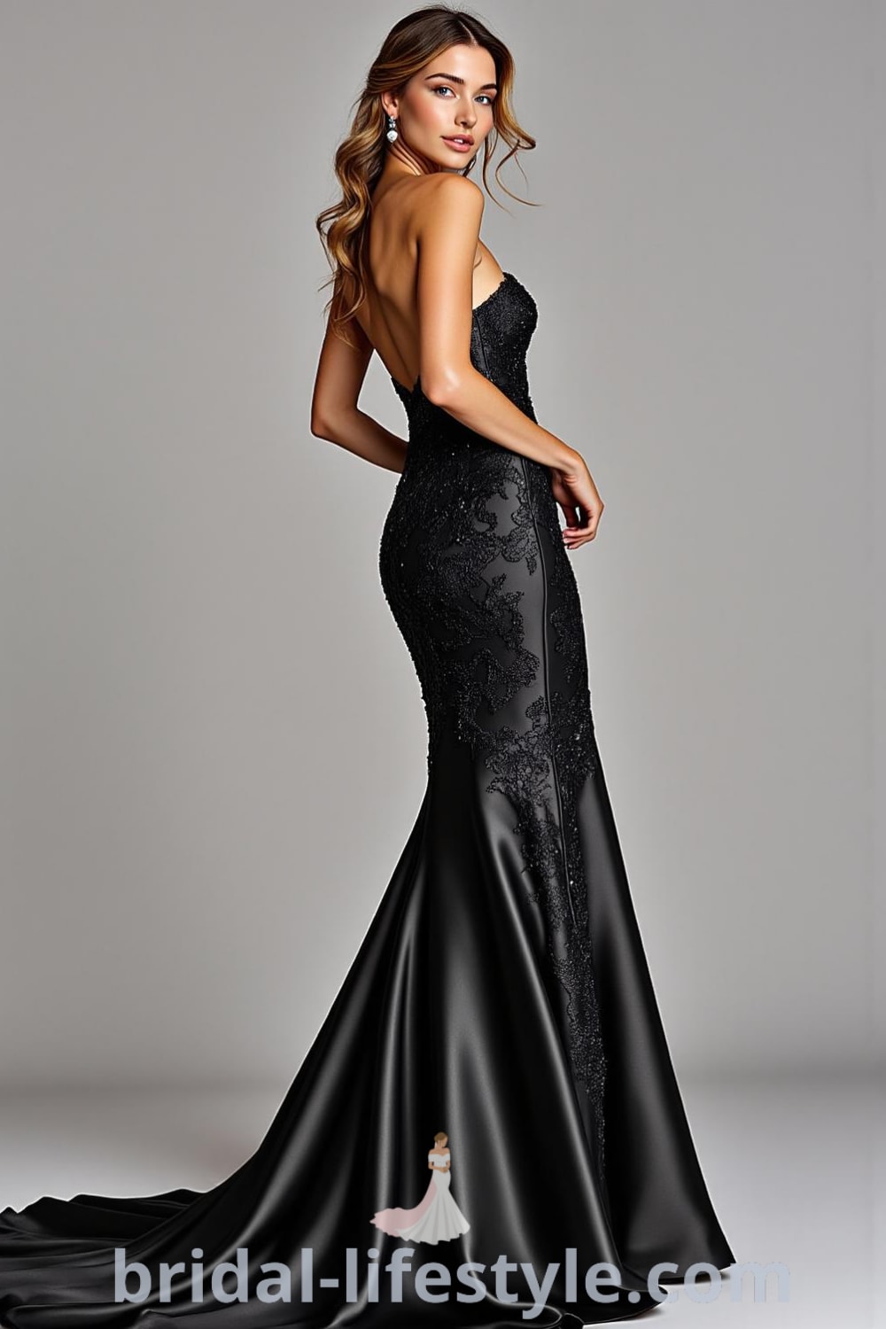 A black satin mermaid wedding dress with lace appliqués, a sweetheart neckline, and an open back featuring delicate buttons, accentuated by a dramatic train. pinshoesoutfits.com