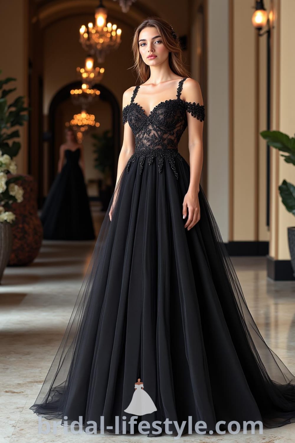 A stunning black wedding dress with a layered tulle skirt, intricate lace bodice, and off-the-shoulder straps, creating an elegant silhouette. bridal-lifestyle.com