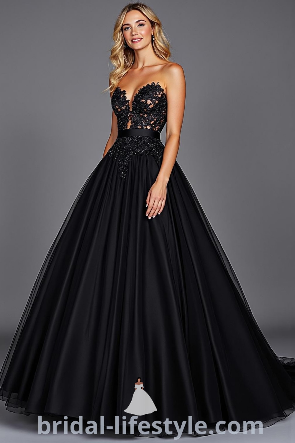 A stunning Princess Black wedding dress featuring a structured bodice with intricate black lace embroidery, a voluminous tulle skirt, and a satin waistband. bridal-lifestyle.com