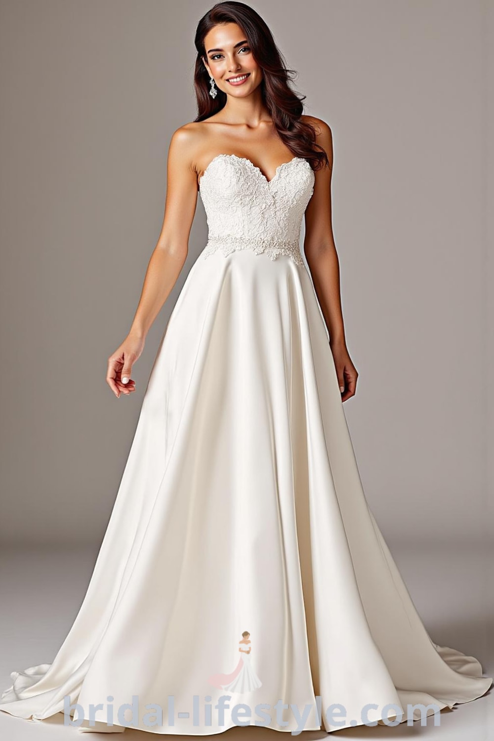 A-line wedding dress with sweetheart neckline, soft satin fabric, flowing skirt, delicate lace appliqués on bodice, and a small train. bridal-lifestyle.com