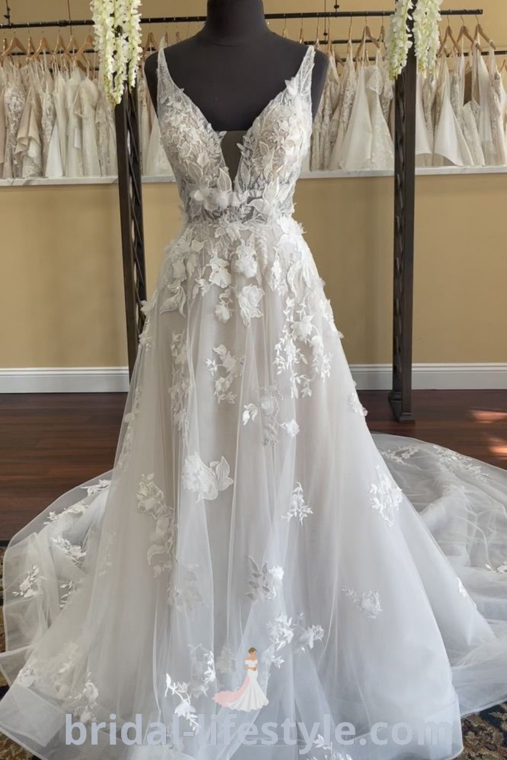 An elegant off-white floral wedding dress showcased at a bridal shop, featuring a romantic lacy A-line design with flowery lace details, perfect for dreamy brides seeking inspiration for their special day. Explore the best wedding dress styles and trends at bridal-lifestyle.com.