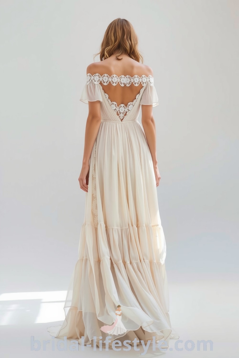 A captivating boho wedding dress in soft chiffon with off-the-shoulder design and tiered skirt, featuring intricate lace trims for a romantic look, designed for dreamy brides. bridal-lifestyle.com