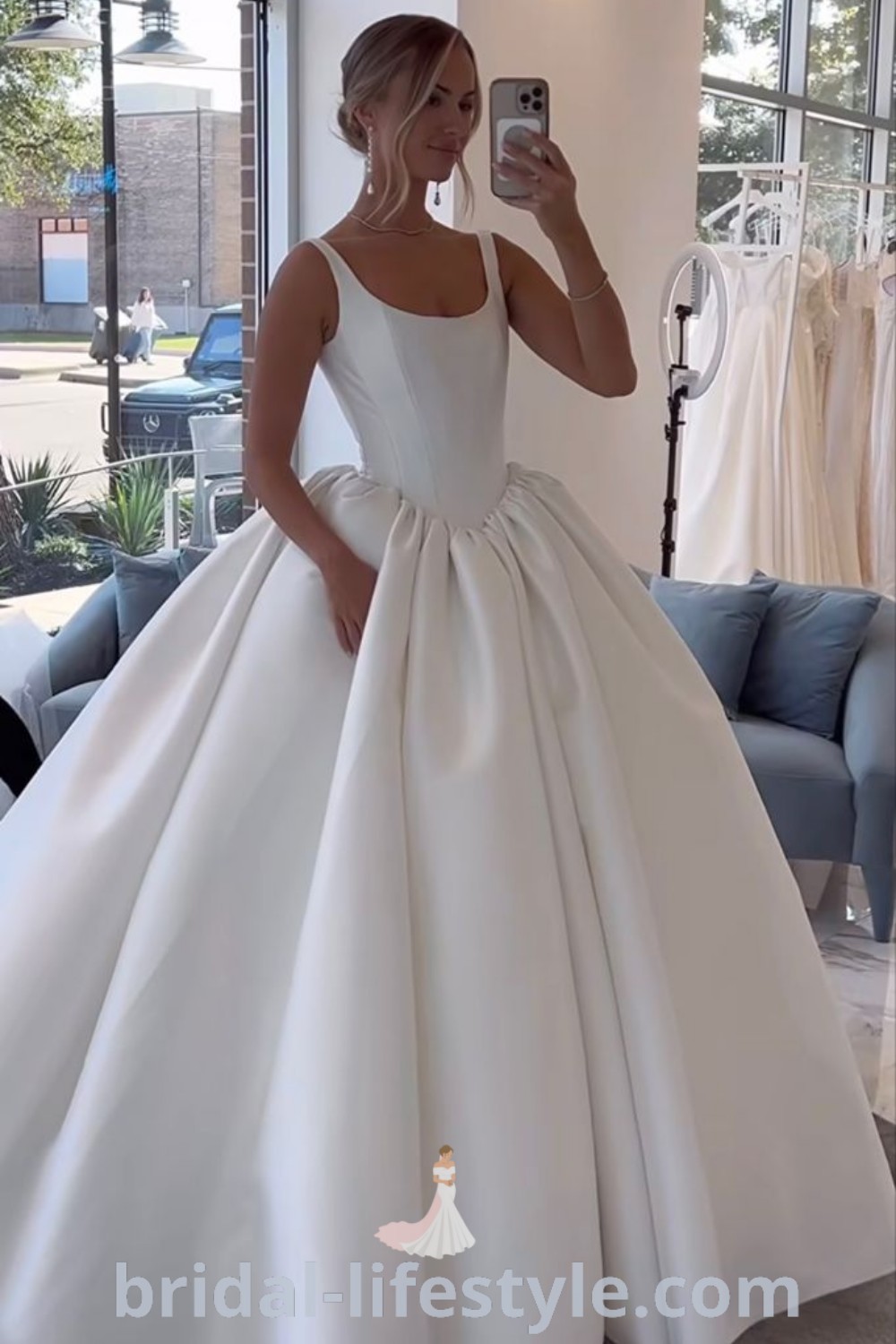 An elegant satin ball gown wedding dress featuring a classy bustier design, perfect for dreamy brides. This luxurious silk gown embodies romantic trends and aesthetic ideas for the special day. Discover your best bridal inspirations at bridal-lifestyle.com.