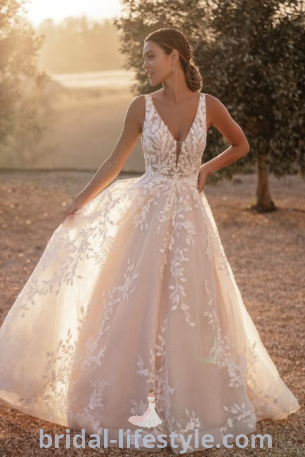 An elegant woman in an affordable Allure Bridal Wedding Dress with her hands on her hips, embodying bridal trends and showcasing the best aesthetic ideas for every bride