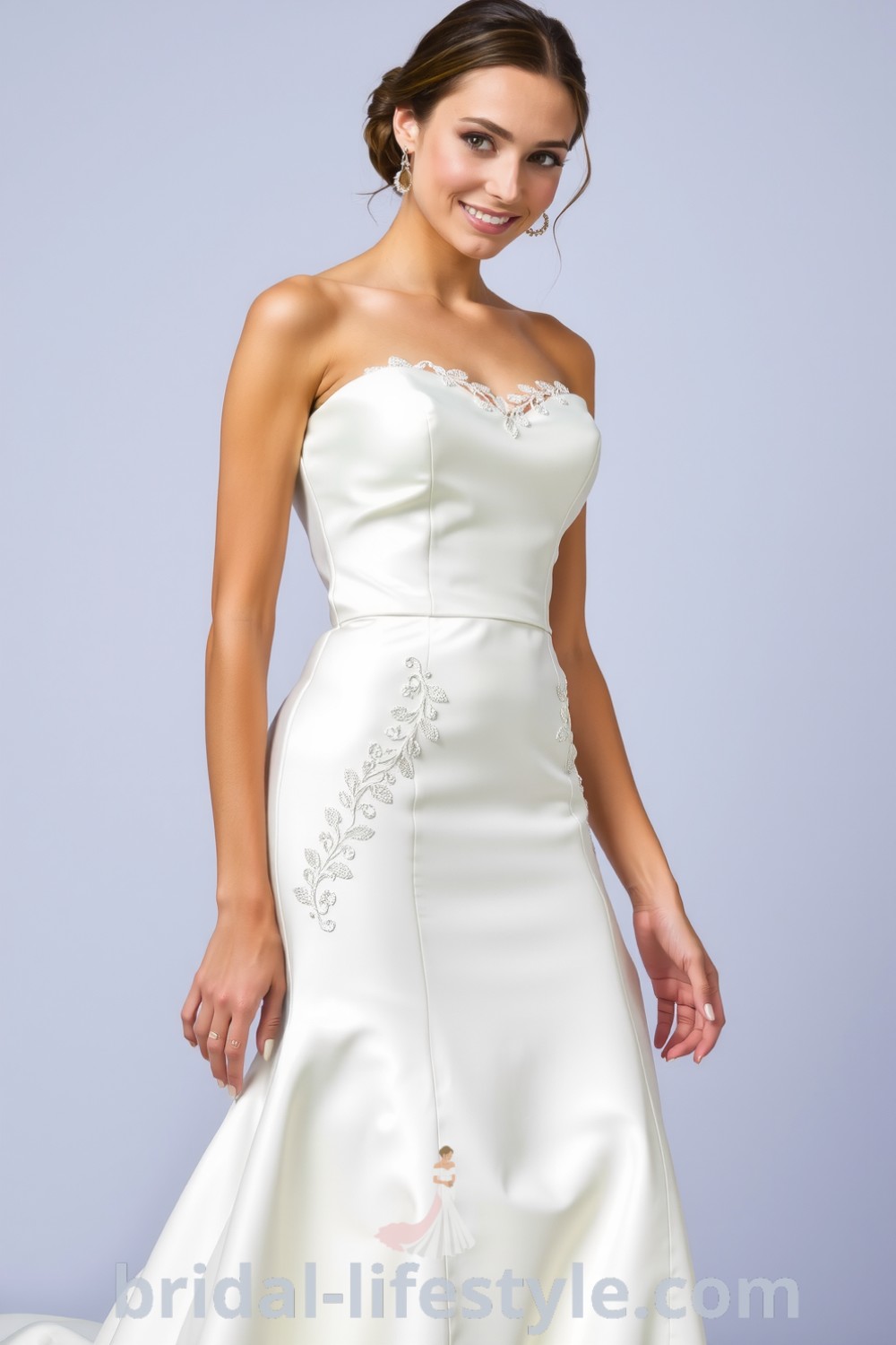 Elegant fit and flare wedding dress with square neckline, luxurious satin fabric, flowing flared skirt, and delicate lace appliqués. bridal-lifestyle.com