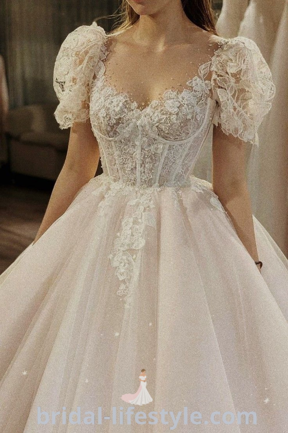 A woman in a beautiful wedding dress with a bouncy skirt and floral sleeves, showcasing romantic and elegant styles for dream brides. Explore bridal trends and the best dreamy dresses designed for your special day at bridal-lifestyle.com.